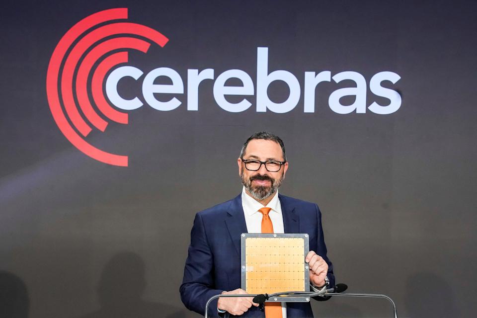 Andrew Feldman, co-founder and CEO of Cerebras Systems, an artificial intelligence chip maker, holds a chip unit during the company’s IPO at the Nasdaq Market site in New York City, U.S., May 14, 2026. REUTERS/Eduardo Munoz · REUTERS / REUTERS